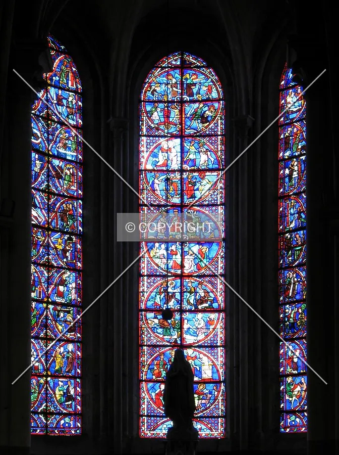 Stained glass windows of the radial chapel dedicated to Our Lady of Lourdes
