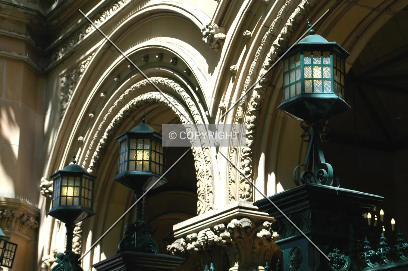View of the lanterns which top the ornate cast-iron gates at the Elizabeth Street entrance