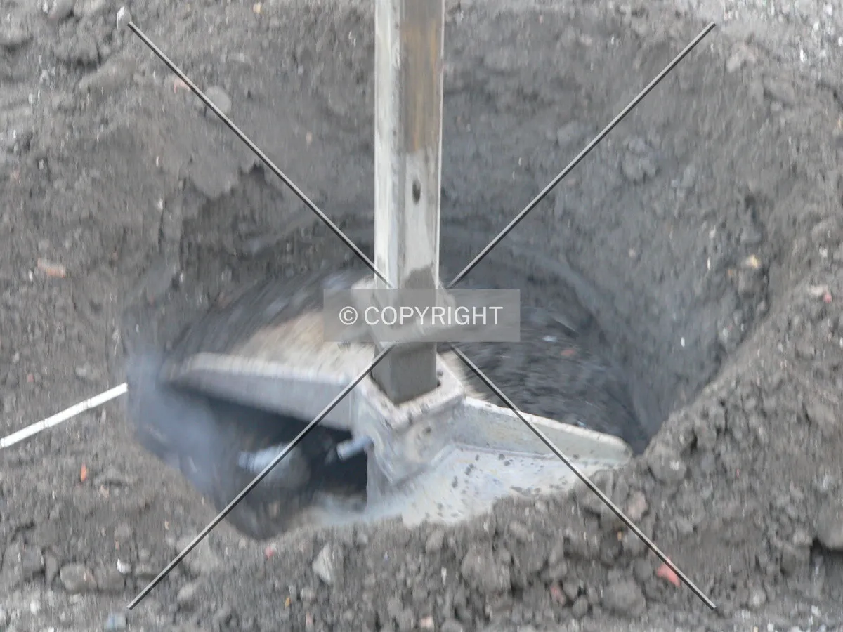 Drilling a caisson hole (A)