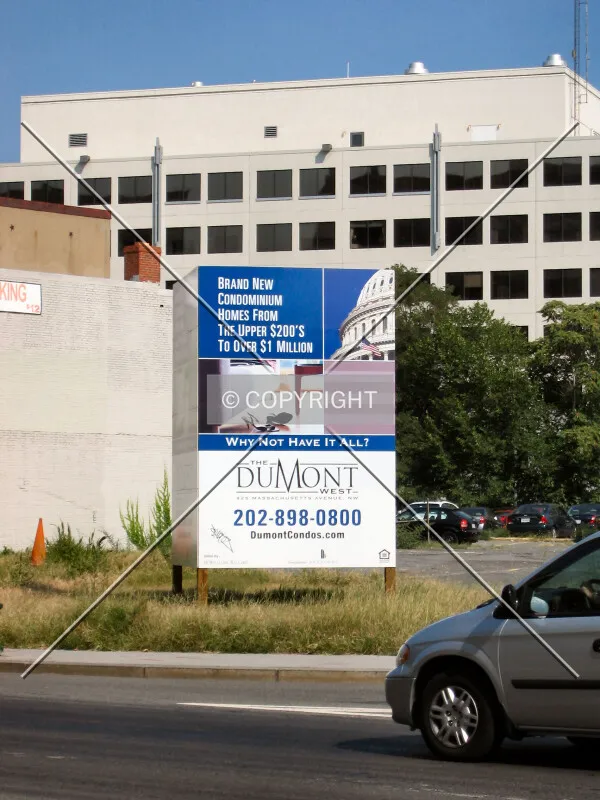 Project board from across Massachusetts Avenue NW