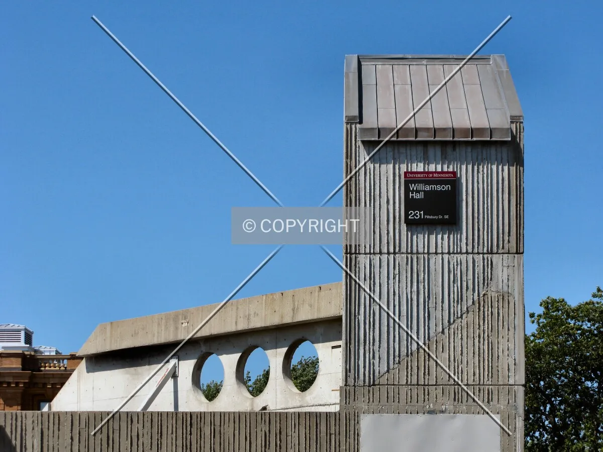 Tower rising over at-grade entrance