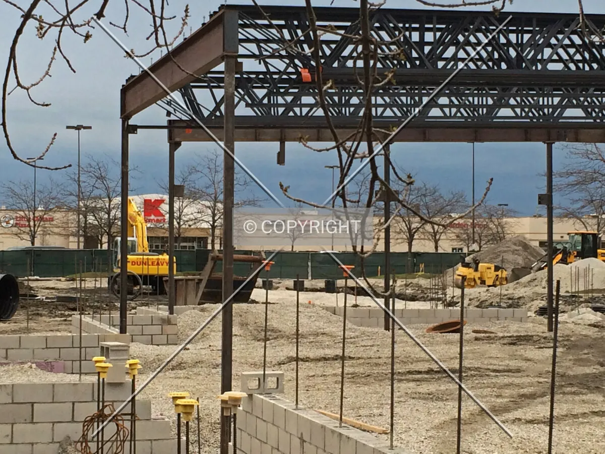 Structural steel and concrete masonry unit wall on the north edge of the structure. April 29, 2014.