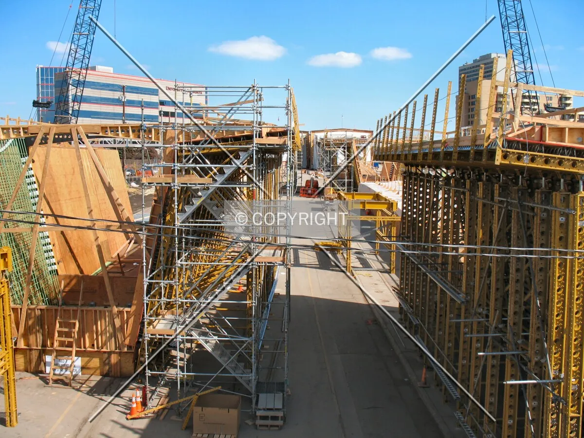 View to the north from the Washington Avenue Bridge over Interstate 35W, now the concrete curing yard for bridge sections