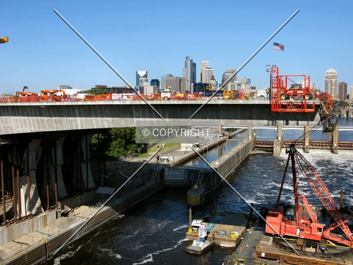 Long center span reaching north from the West Bank