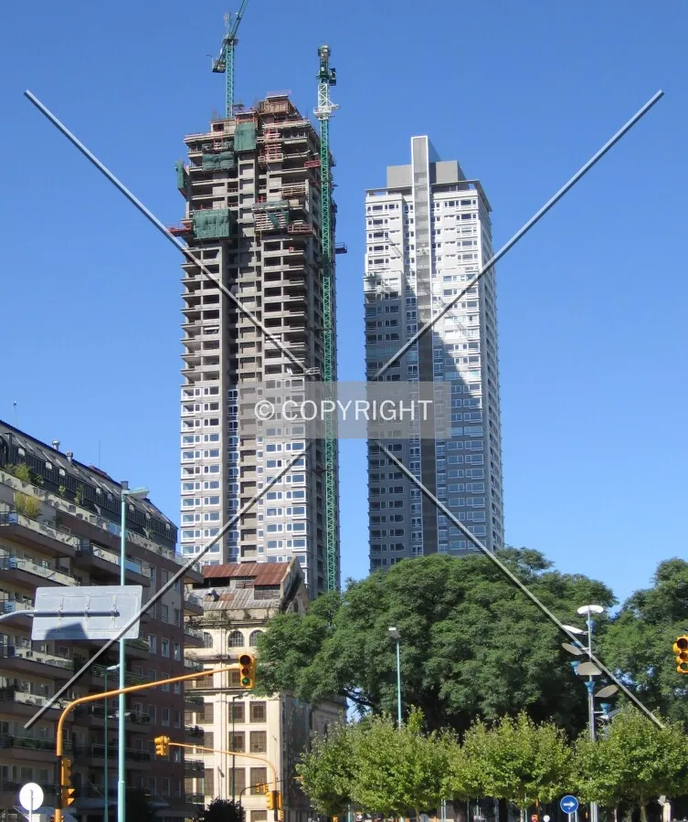 Torre del parque at left, at right torre del río (completed)