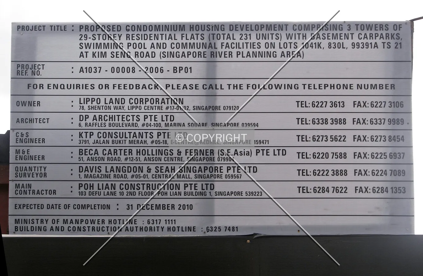 Project information displayed at the construction site fence