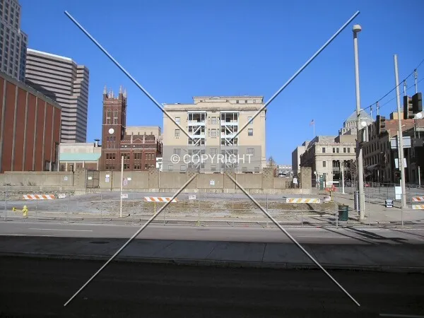 View of fenced-off lot from across 3rd Street