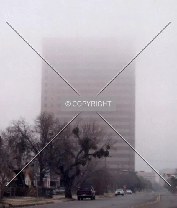 A cold foggy morning in Abilene. Bank of America Building from the South