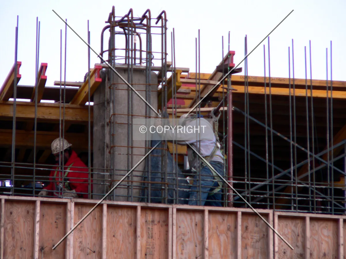 Workers working on the rebar and formwork installation