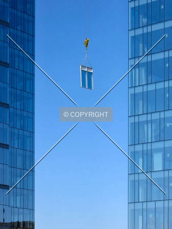 Windows traveling between the towers, on the way to installation