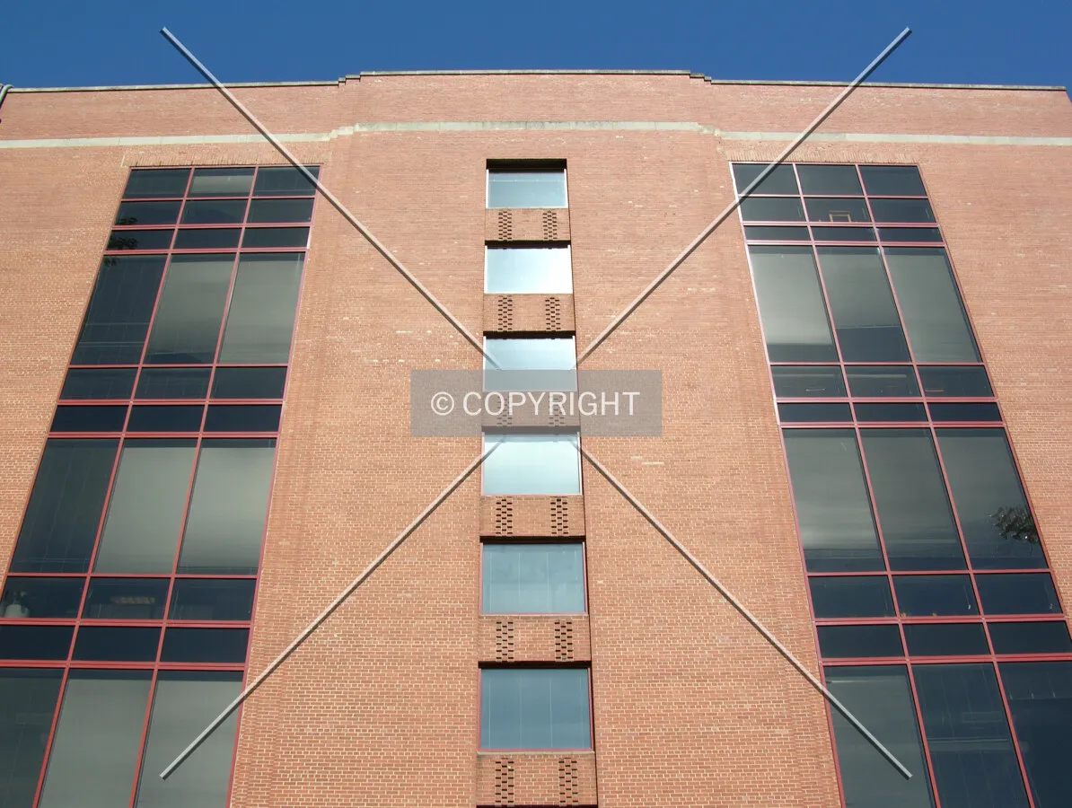 Looking up from across Blackwell Street to the east