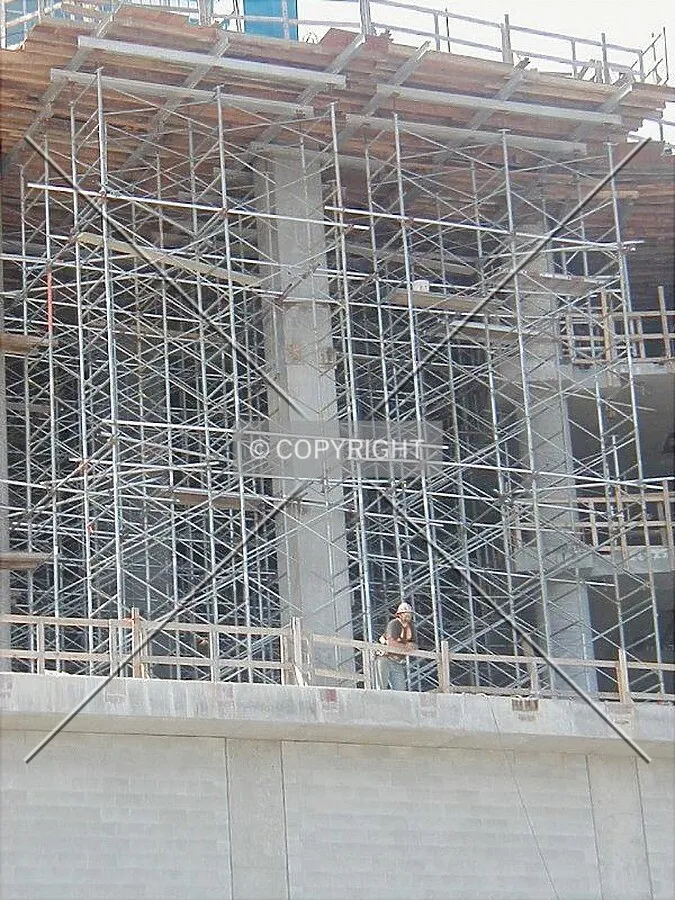 Scaffolding and worker on a Saturday