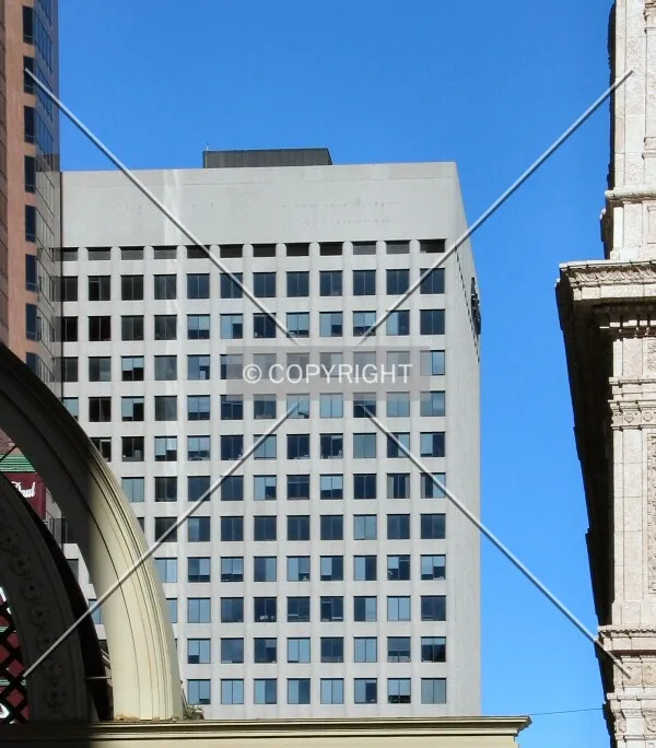 Distant view to the east along West 7th Place, framed by Wells Fargo Place and the Hamm Building