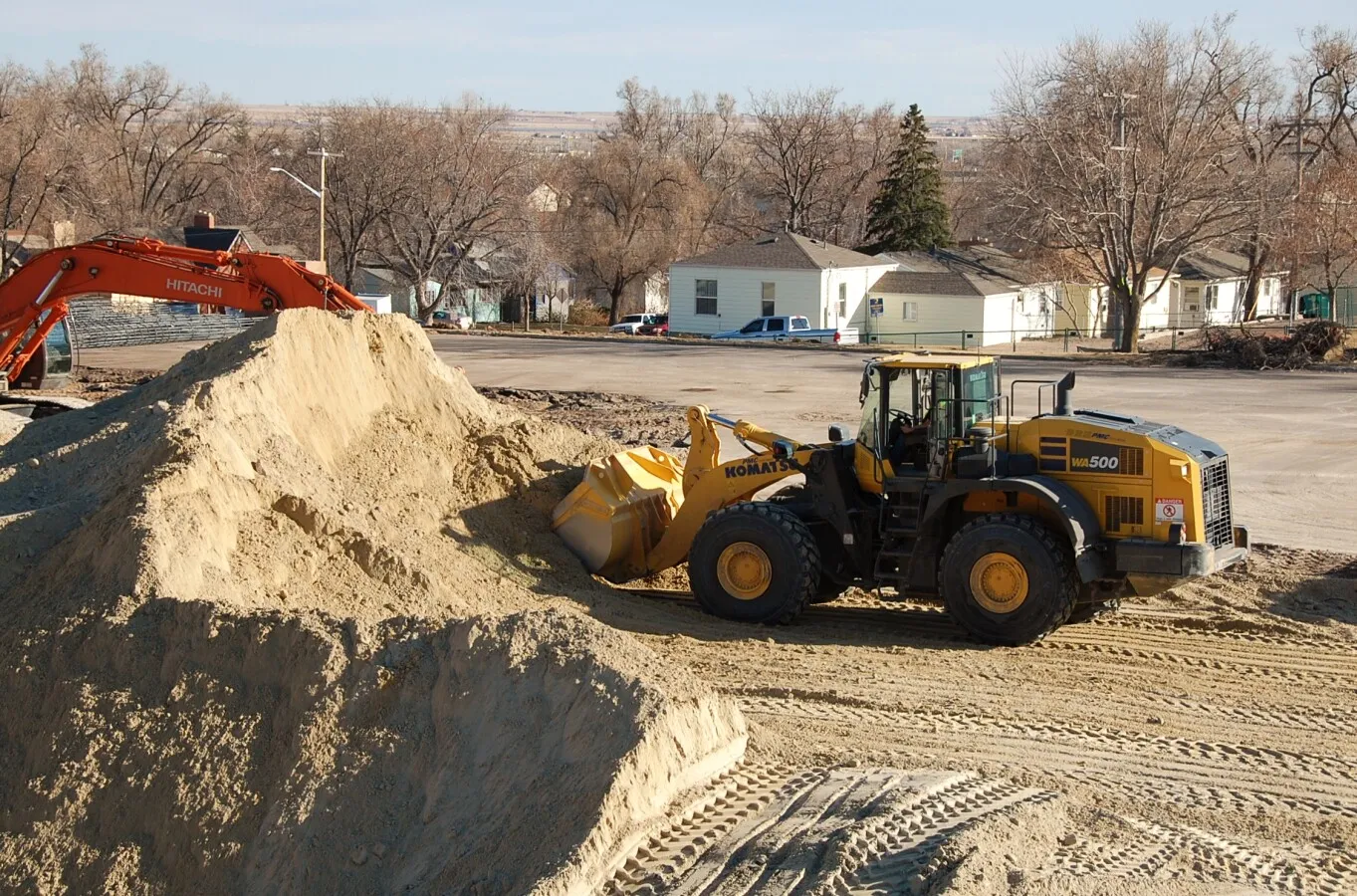 Front loader scooping up some dirt
