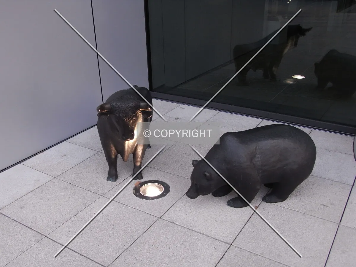 Bull and bear in front of Deutsche Börse Cube building