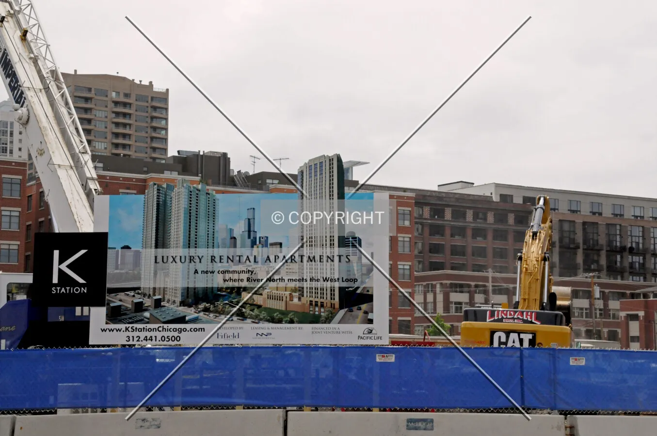 Advertising sign and perimeter fence along Kinzie Street