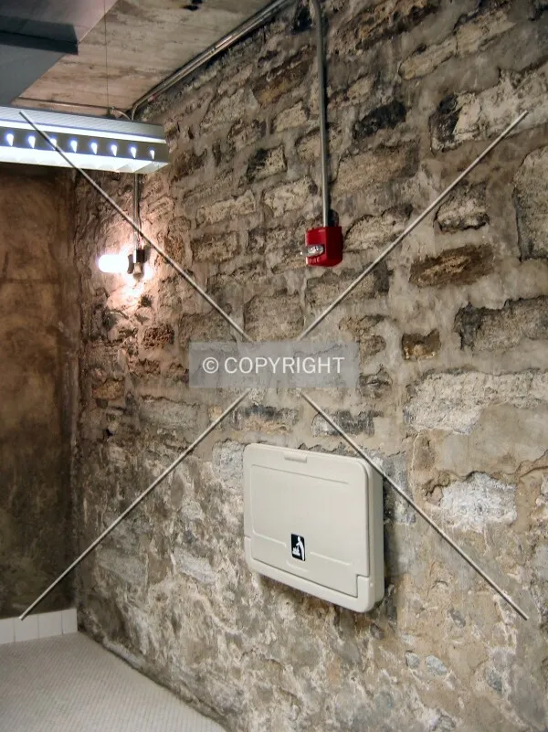Original stone walls in the men's restroom