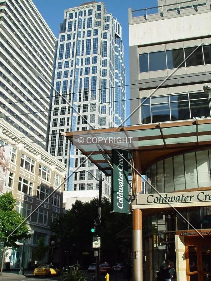 Flanked on the left and right by shorter buildings