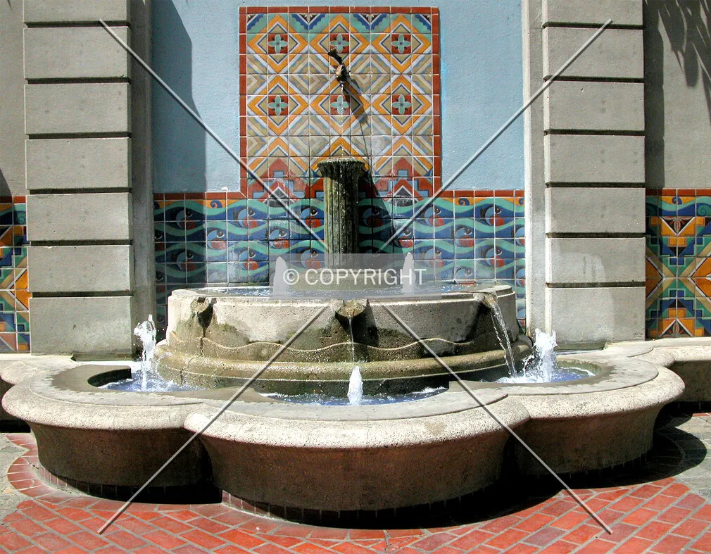 A colorful Spanish-style fountain in one of the plazas