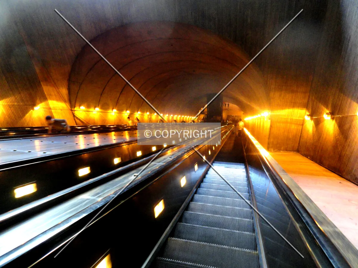 Looking down the third longest continuous span escalator in the world descending to the station platform