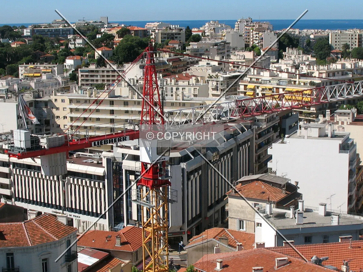 Lowest tower crane viewed from the highest one, with Antibes in background