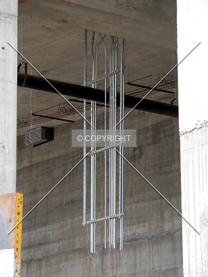 Conduit hanging from the lobby ceiling