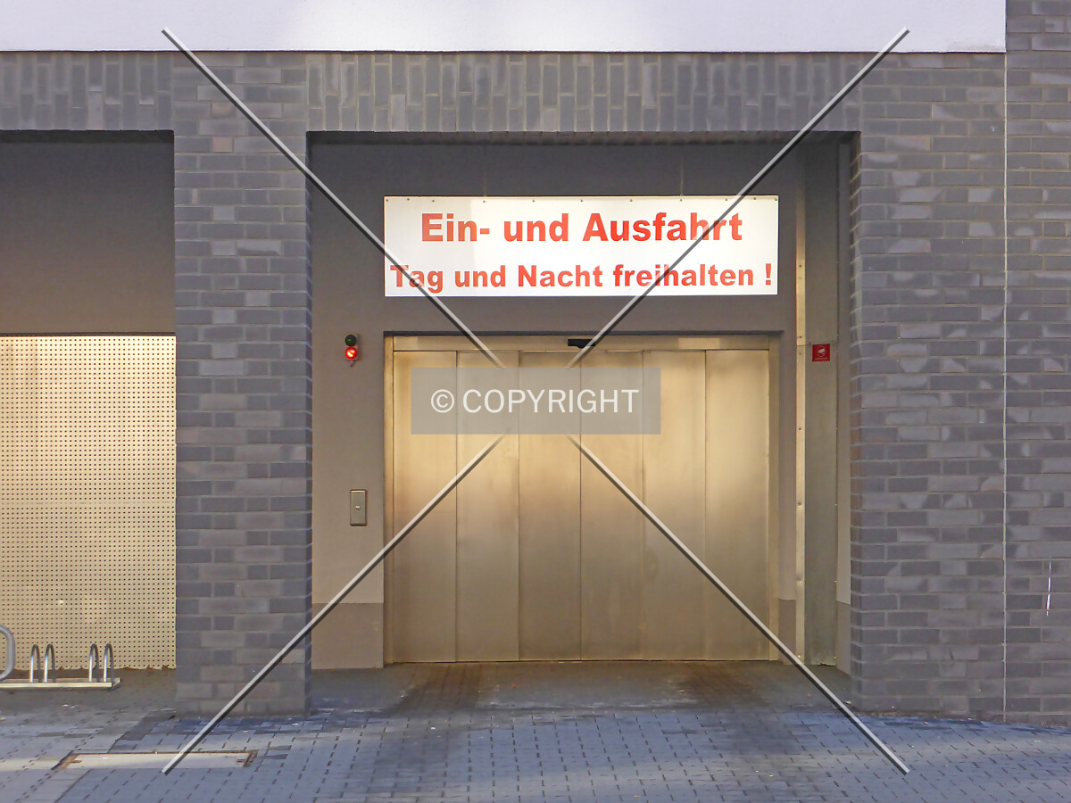The door of a car lift leading to the underground car park