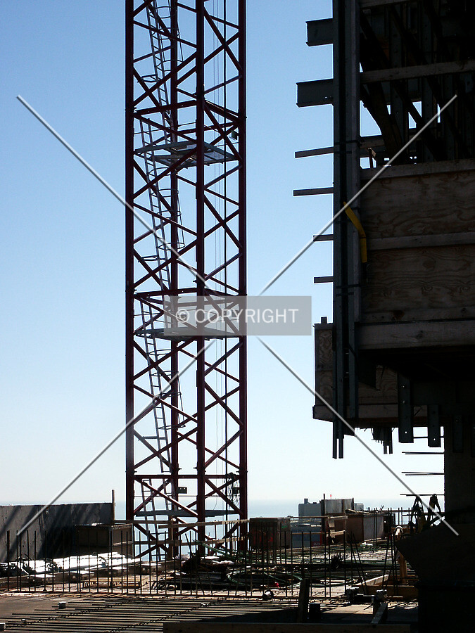 Tower crane rising past the core