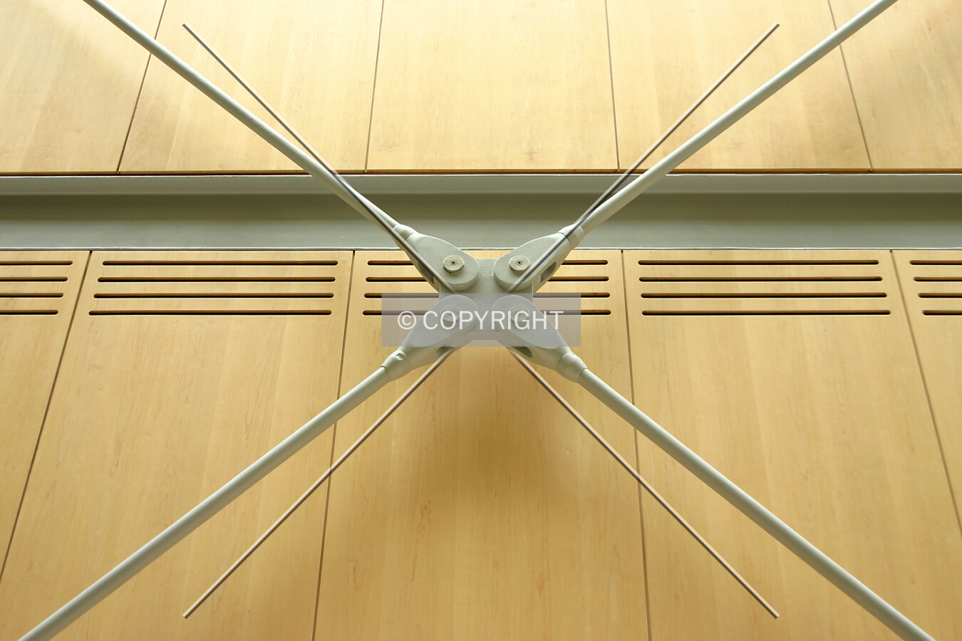 Steel cross bracing backed by maple panels