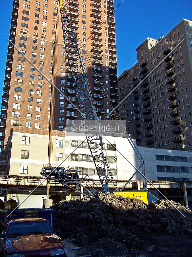 Caisson drill rig on the northeast corner of the site, near 8th Street