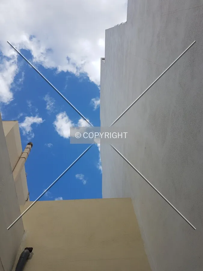 Walls without windows during a summer day