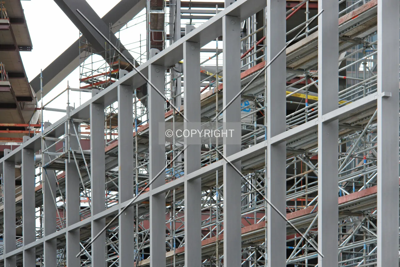 The construction of the facade which will connect both towers is starting at the base