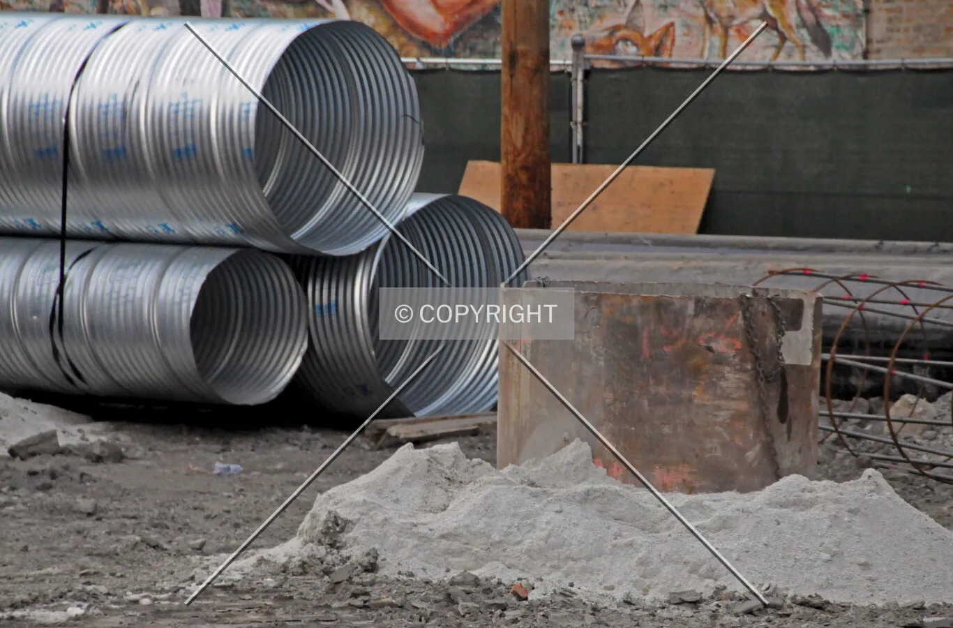 Caisson top in the ground, with caisson liners in the background