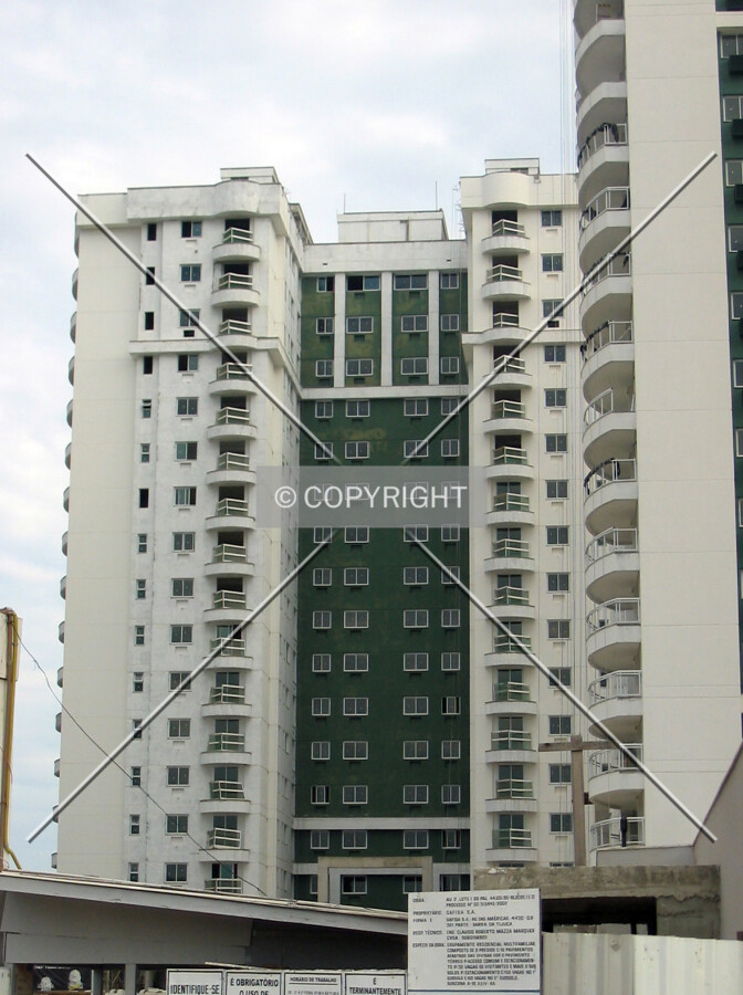 The west facade receives its first layer of paint
