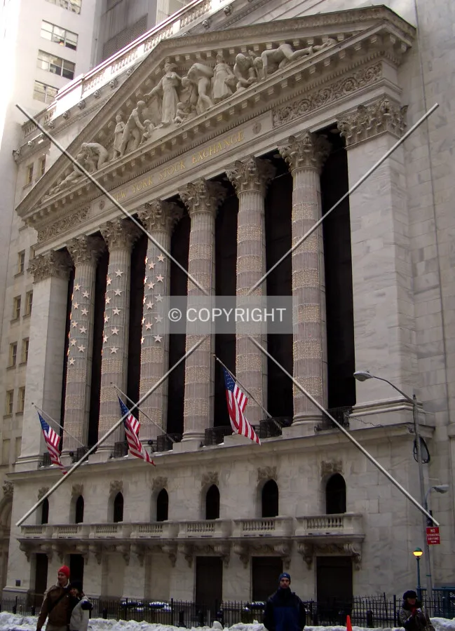 A flag made up of lights adorns the columns on famous eastside façade