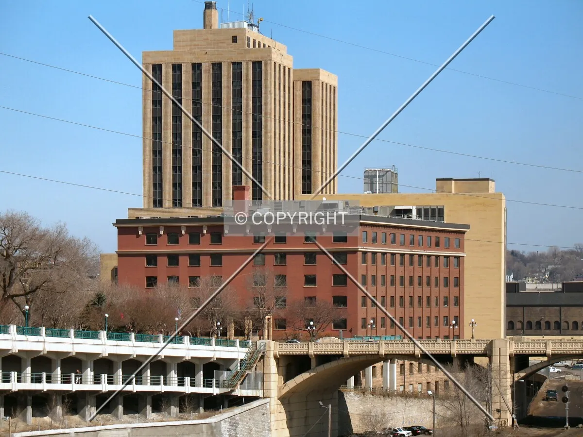 Distant view to the east from the Wabasha Street Bridge, beyond the foot of the Robert Street Bridge with the Post Office looming behind