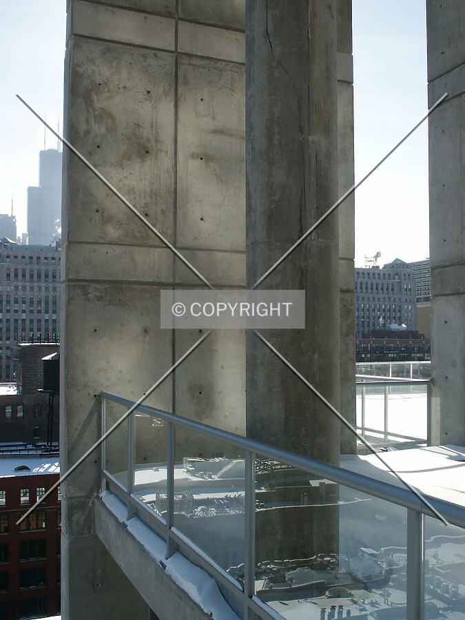 Exposed column and concrete wall slab at the 14th floor level