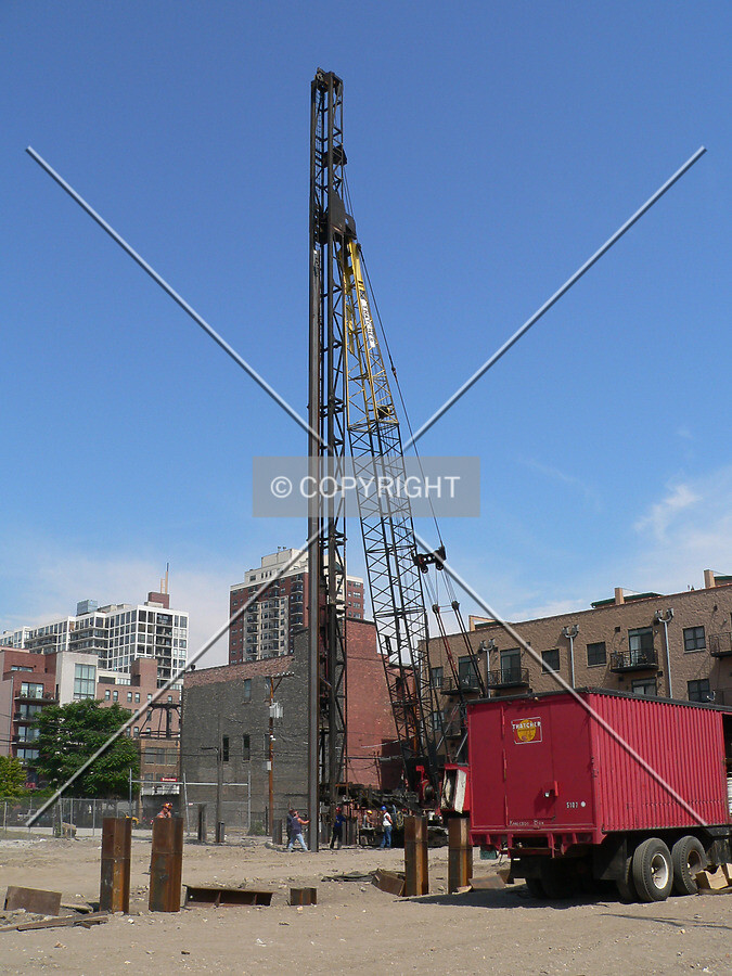 A pile driver driving a pile