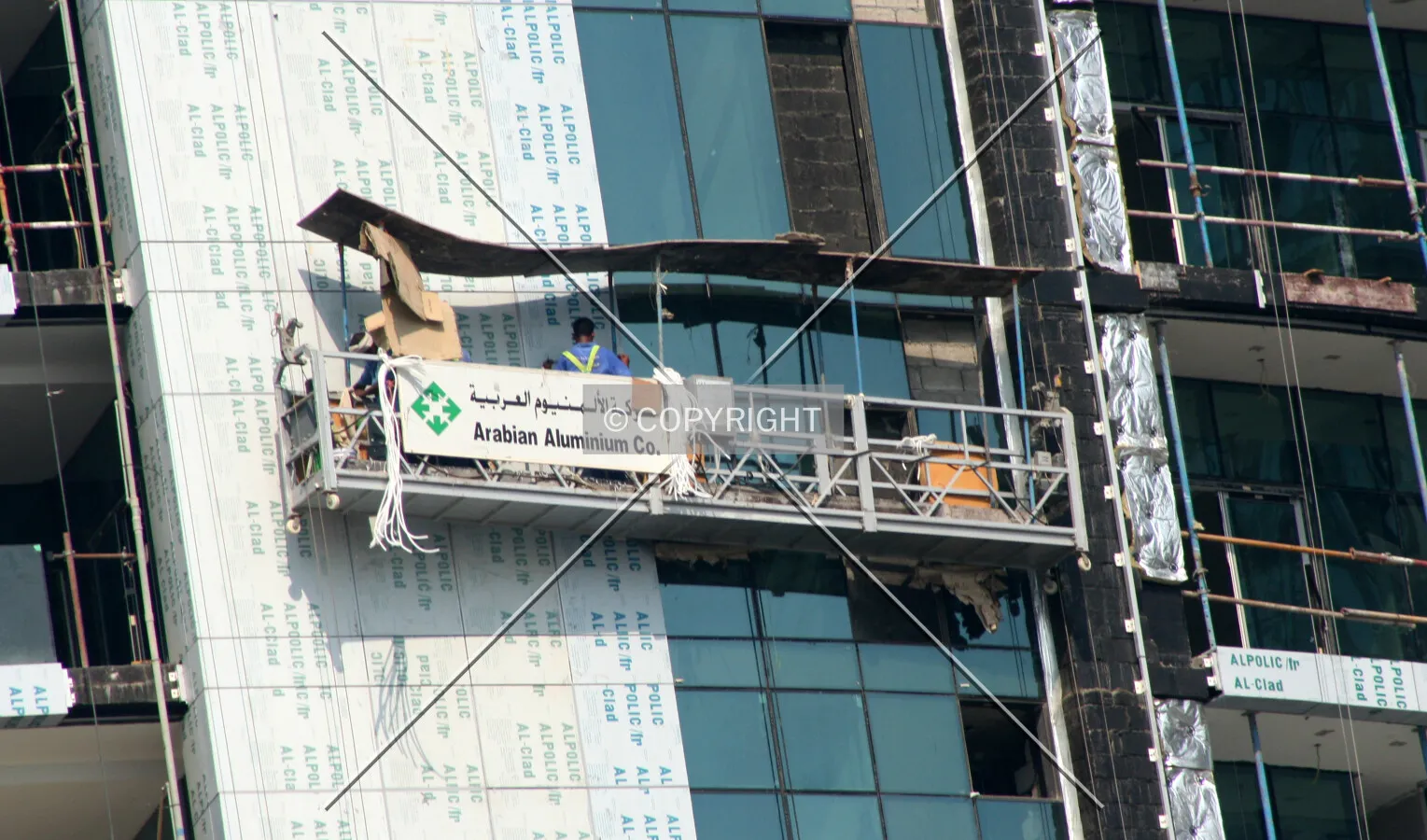 Construction worker fitting the facade