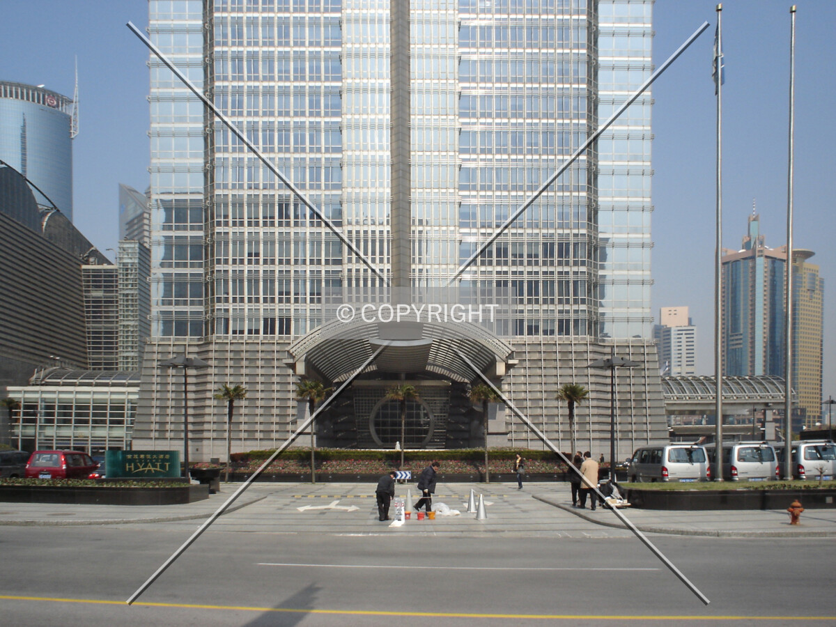 Straight view to a main entrance and the base of the skyscraper