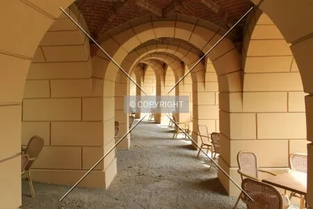 Under the arcade in front of the castle