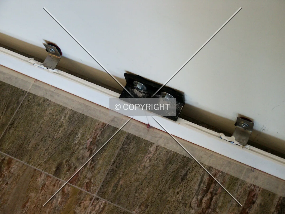 Base of the lobby wall without the marble paneling