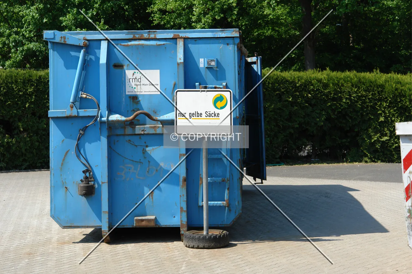 A blue container for plastic collection
