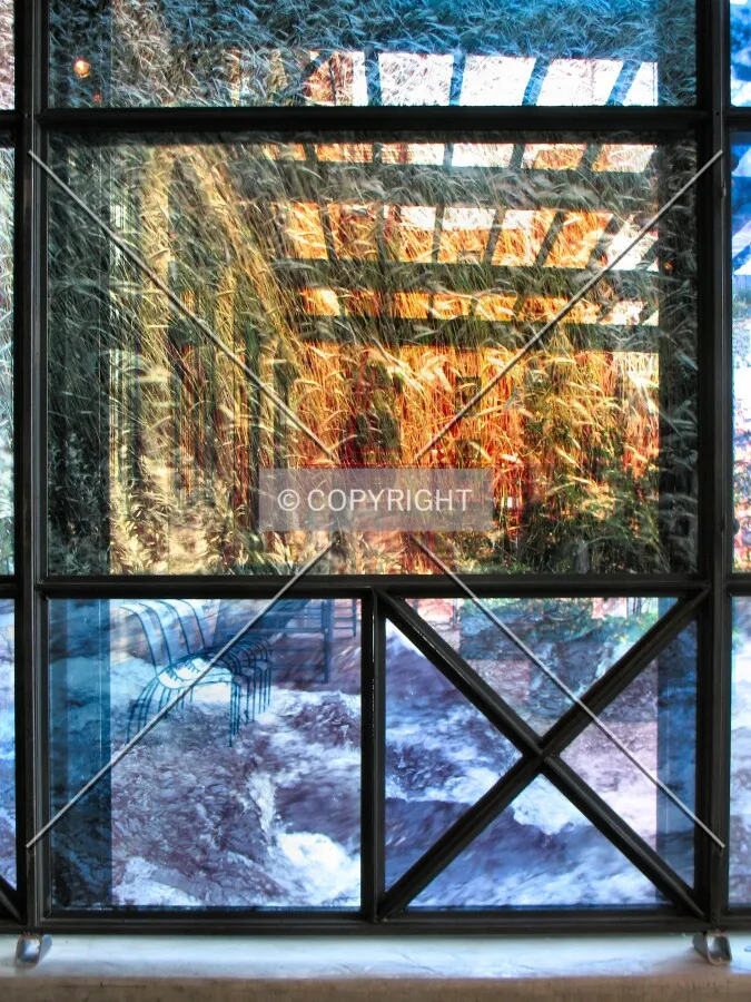 Detail of the south window on the east side, featuring wheat and water, critical elements for the city's milling past
