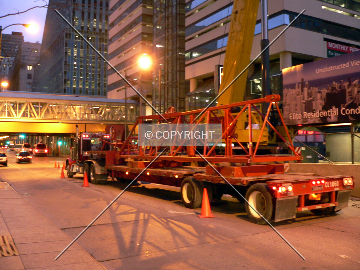 A section of tower crane lying on a flatbed truck