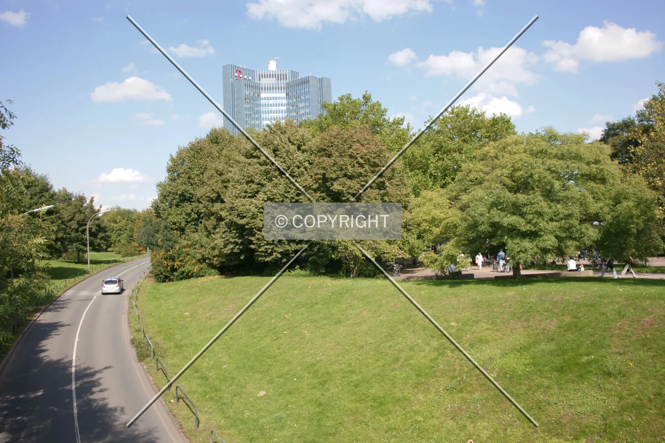 A lot of green and the glass tower of Deutsche Telekom in the background