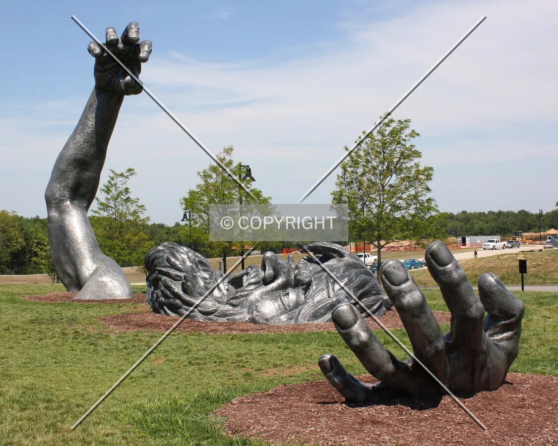 His head and hands coming out of the ground