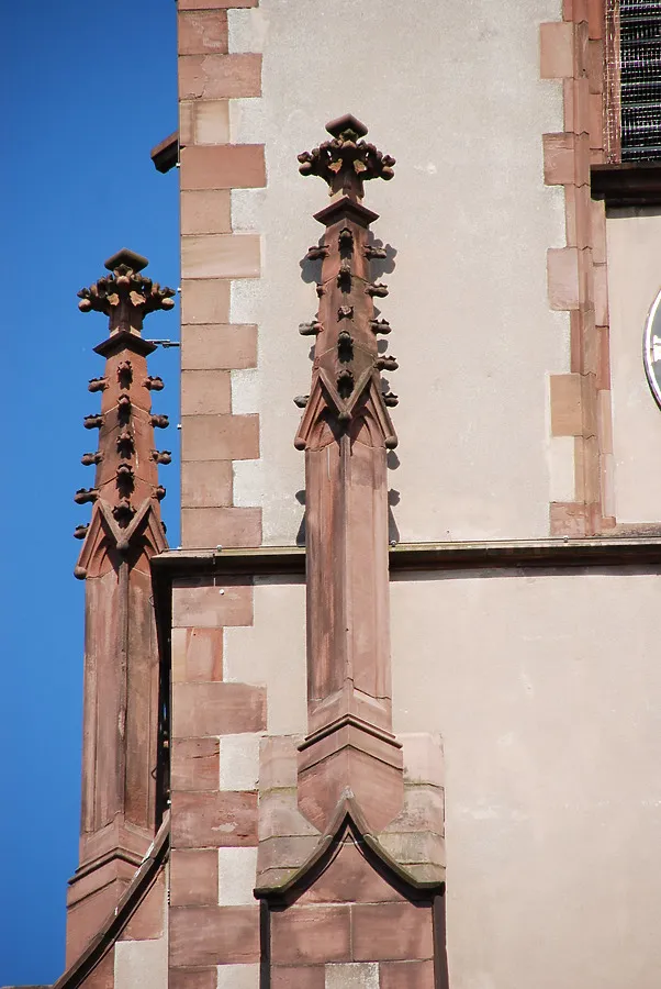 Small decorated spires attached to the main church spire