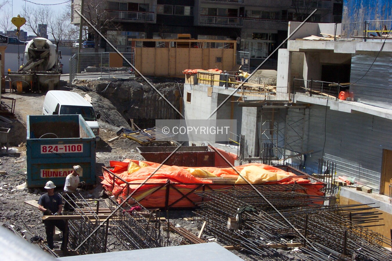 Preparing the steel rods and concrete that will set the base of the tower