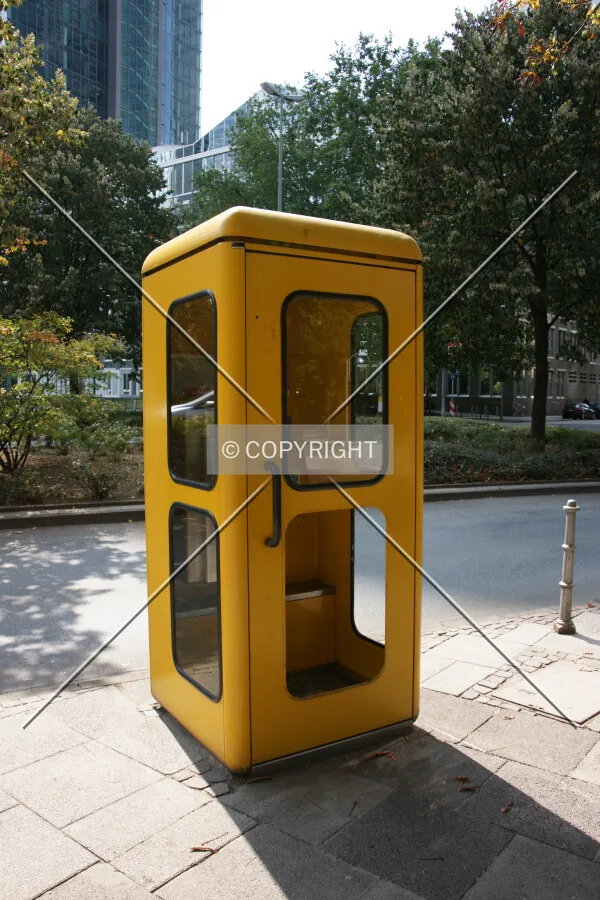 A yellow phone box in Germany